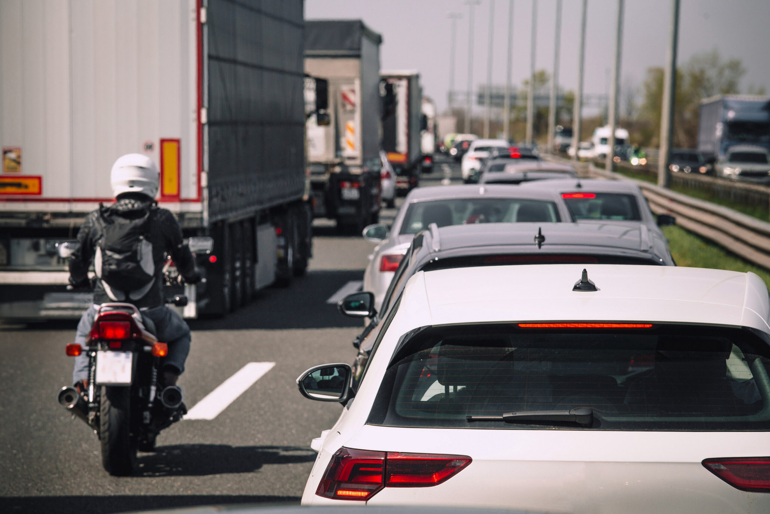 Traffic jam on highway cars trucks motorcycle